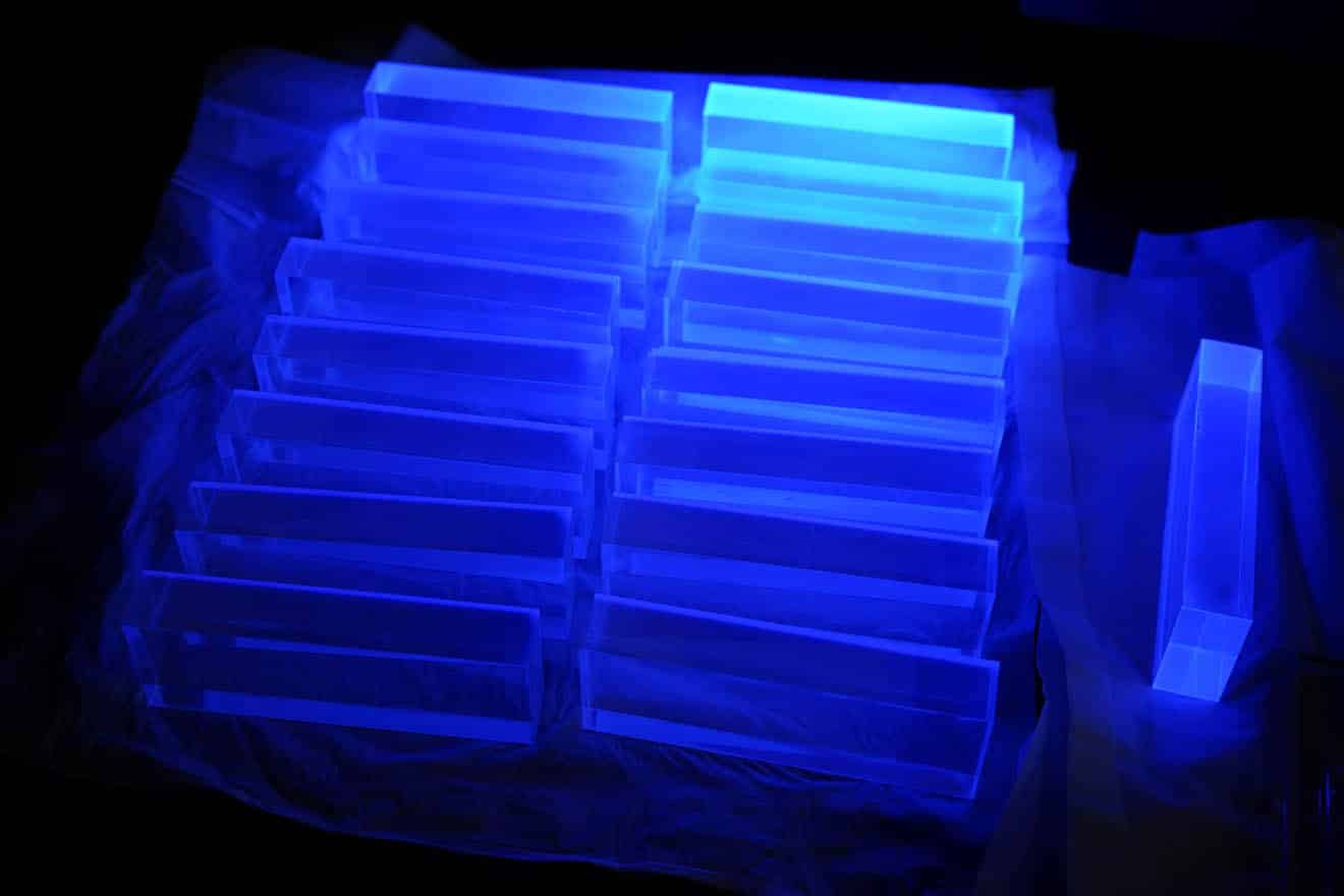 Blue glowing scintillator, black in the background.